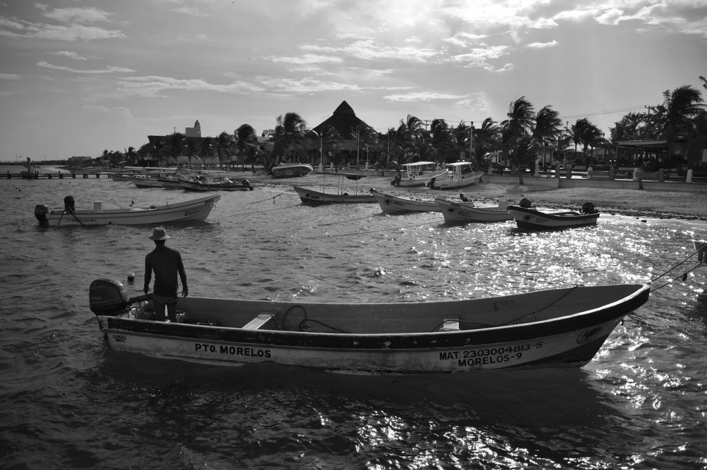 Puerto_Morelos-boat-ocean-palms-sand